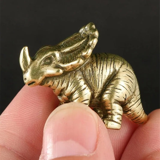 Vintage solid copper horned dinosaur figurine, hand-carved bronze model for Jurassic decor.