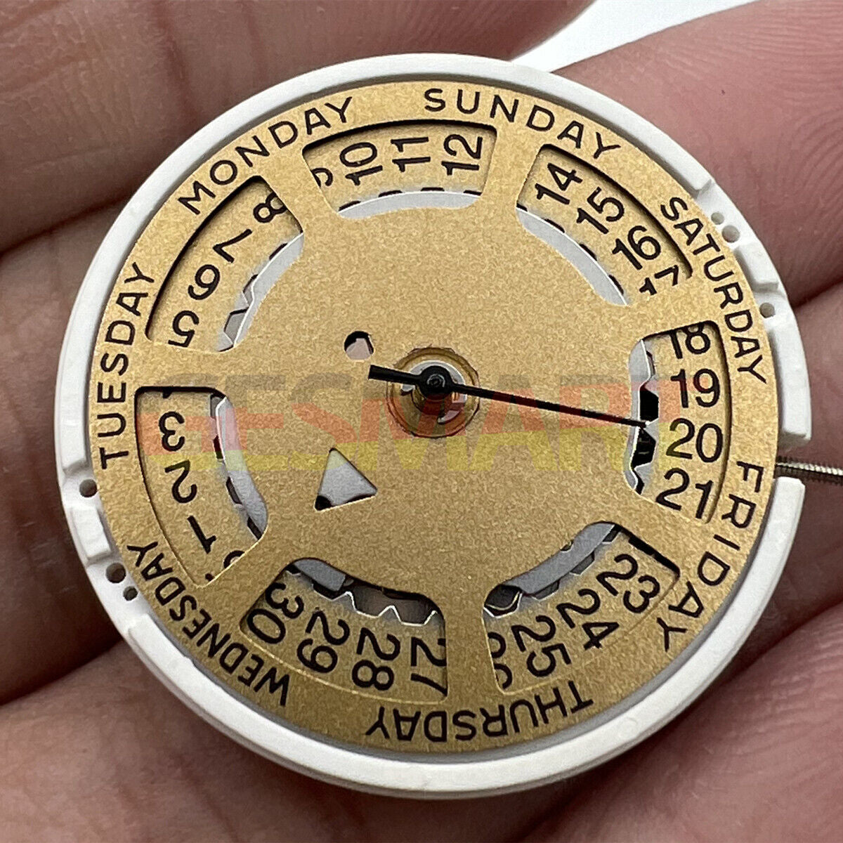 Watchmakers ISA 1198 quartz movement watch with golden dial and day-date display at 3 o'clock, replacement part.