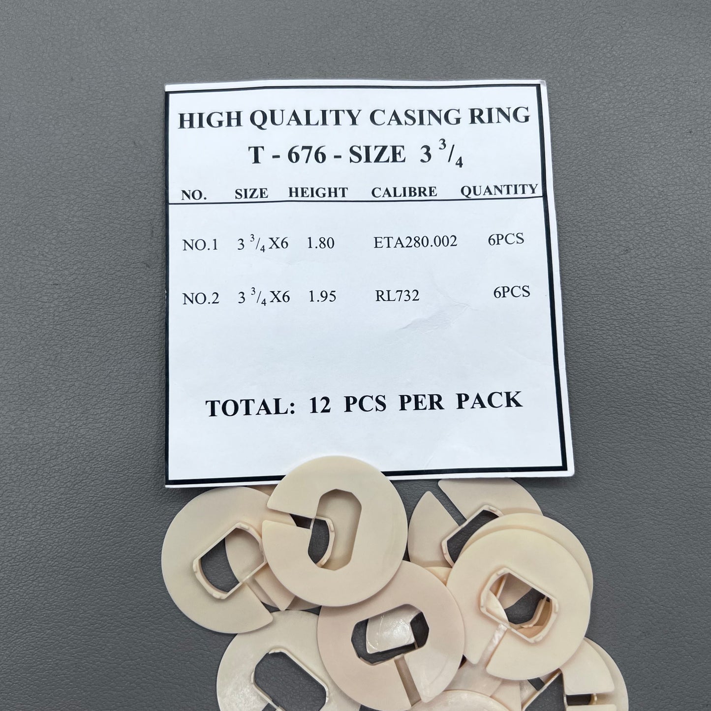 Set of 12 2-line watch movement case spacers, size 3.75, for precise accessory fitting.