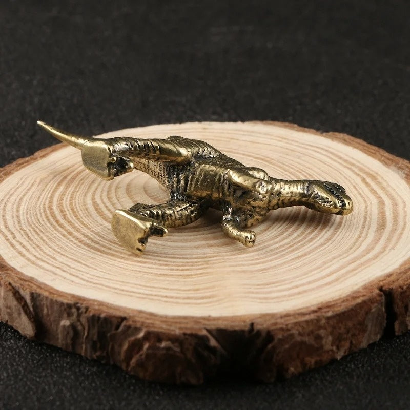 Solid copper Tyrannosaurus Rex figurine with vintage bronze accents, collectible trinket for display.