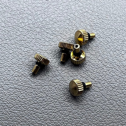 Set of 5 golden watch crowns compatible with Orient watch movements, ideal for stylish repairs.