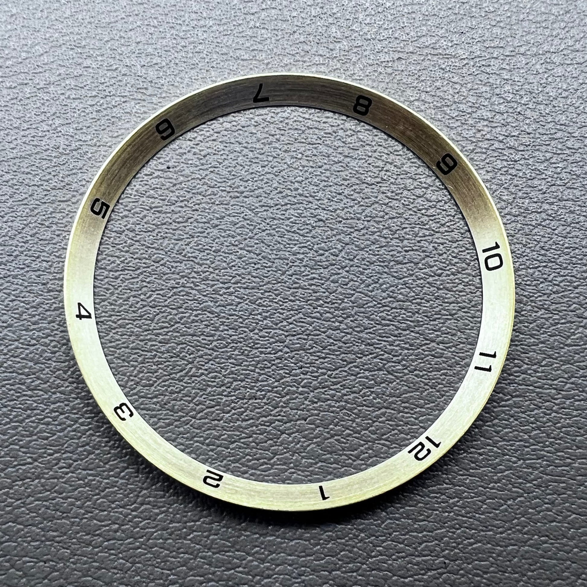 Golden stainless steel chapter ring for watches, 34.9x31.0x1.9mm, durable accessory.