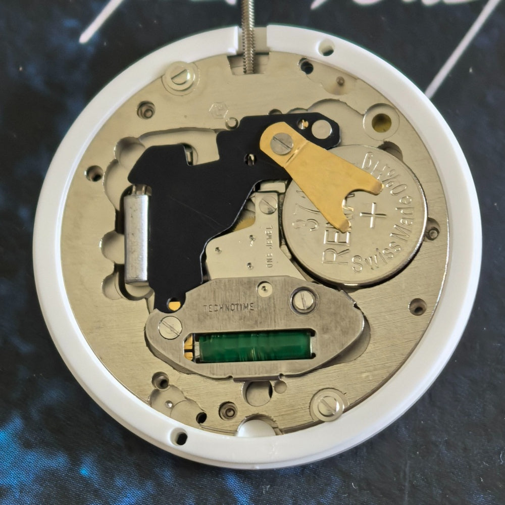 FE 7531 quartz movement watch repair part with three hands for accurate timekeeping.