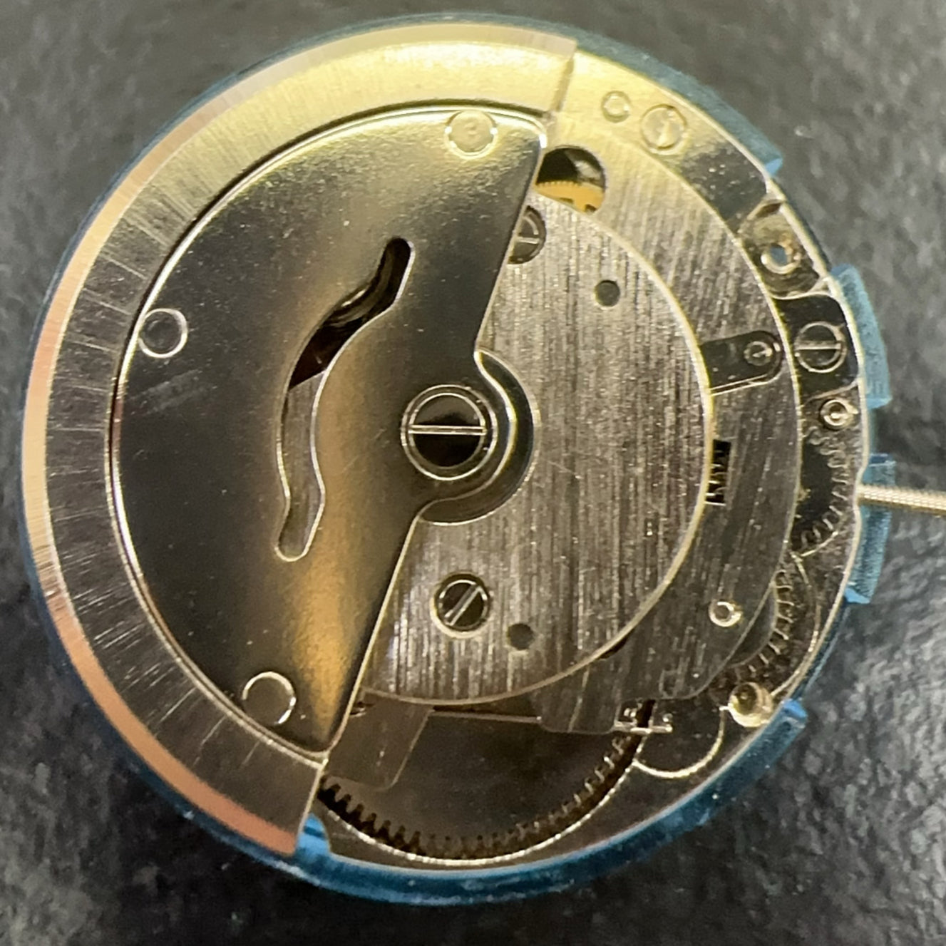 Tianjin 2813 mechanical watch movement with single calendar and three hands for precision timekeeping.