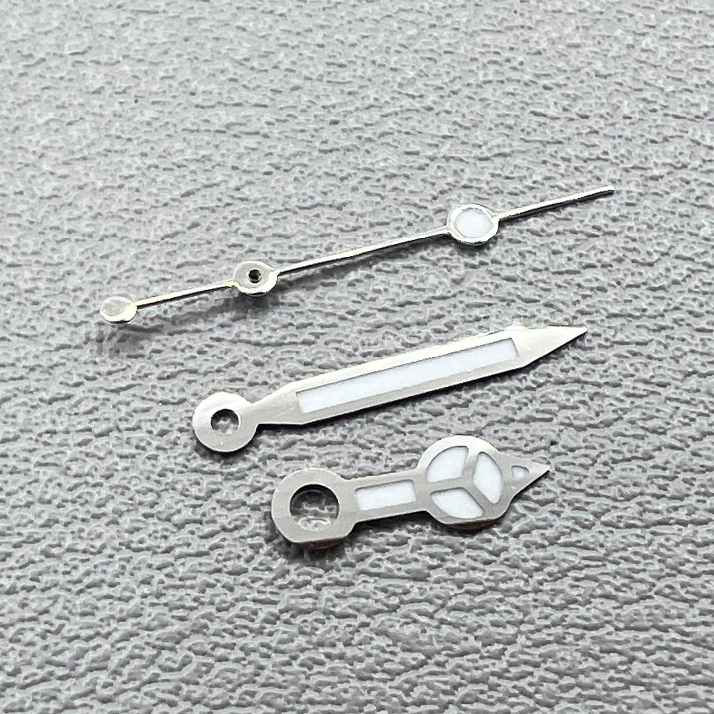 1. Silver-trimmed green lume watch hands set for NH05 NH06 movements.  