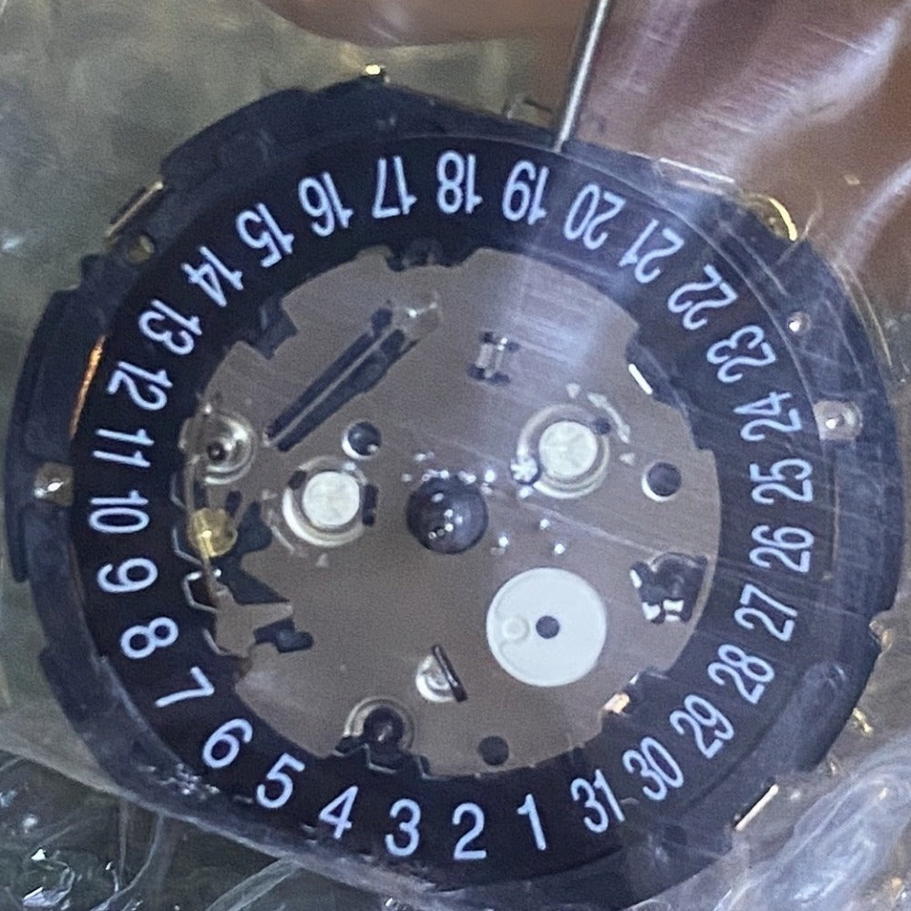 Seiko 7T82A quartz watch movement with single calendar and black date disk at 6 o'clock.