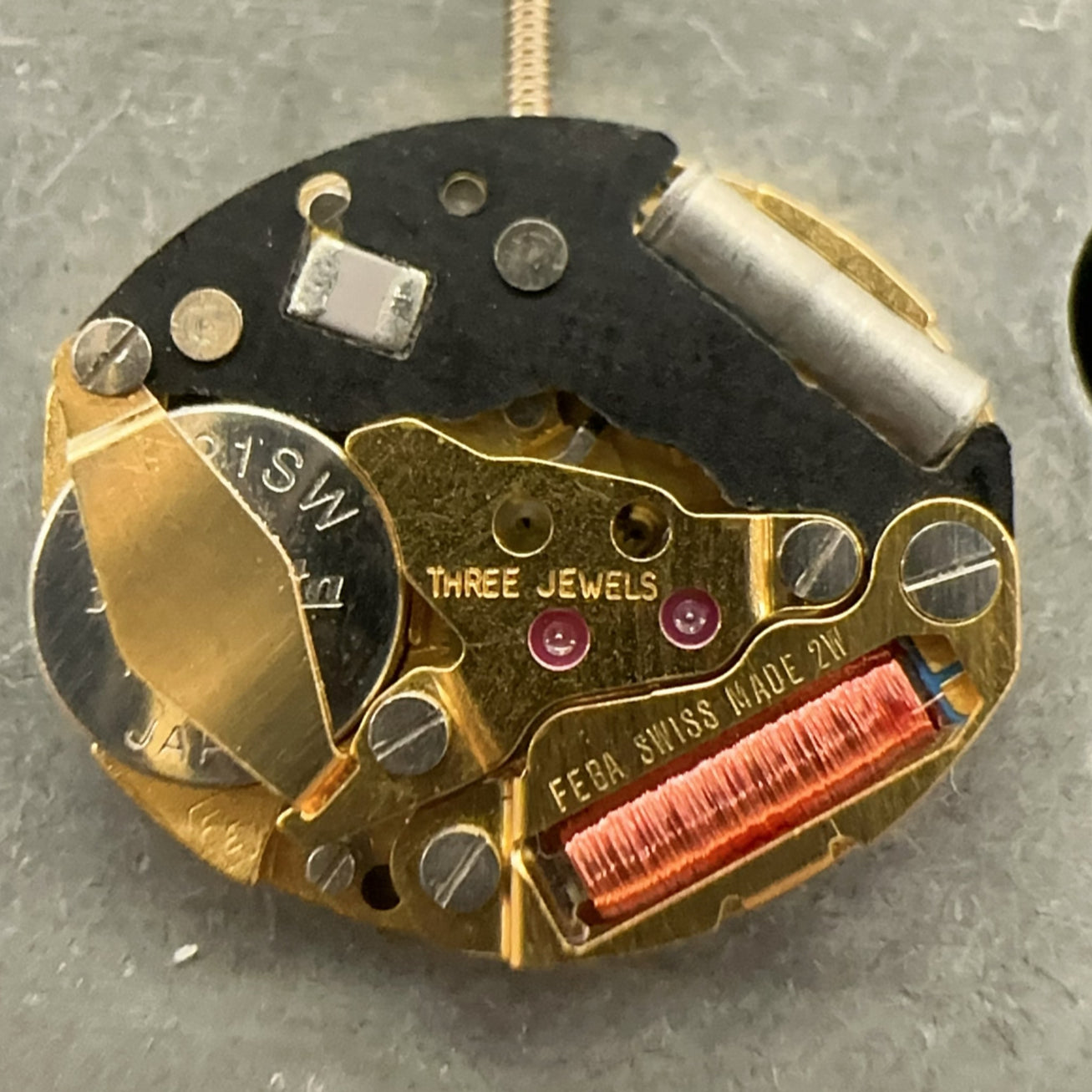 Swiss Made ETA980.003 quartz movement black circuit board for precision watch repair.