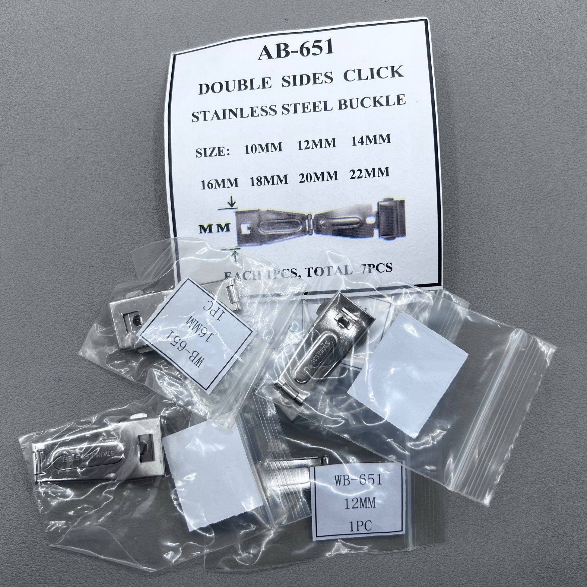Set of 7 silver stainless steel watch buckles, 10-22mm, polished double-sided for secure clicks.