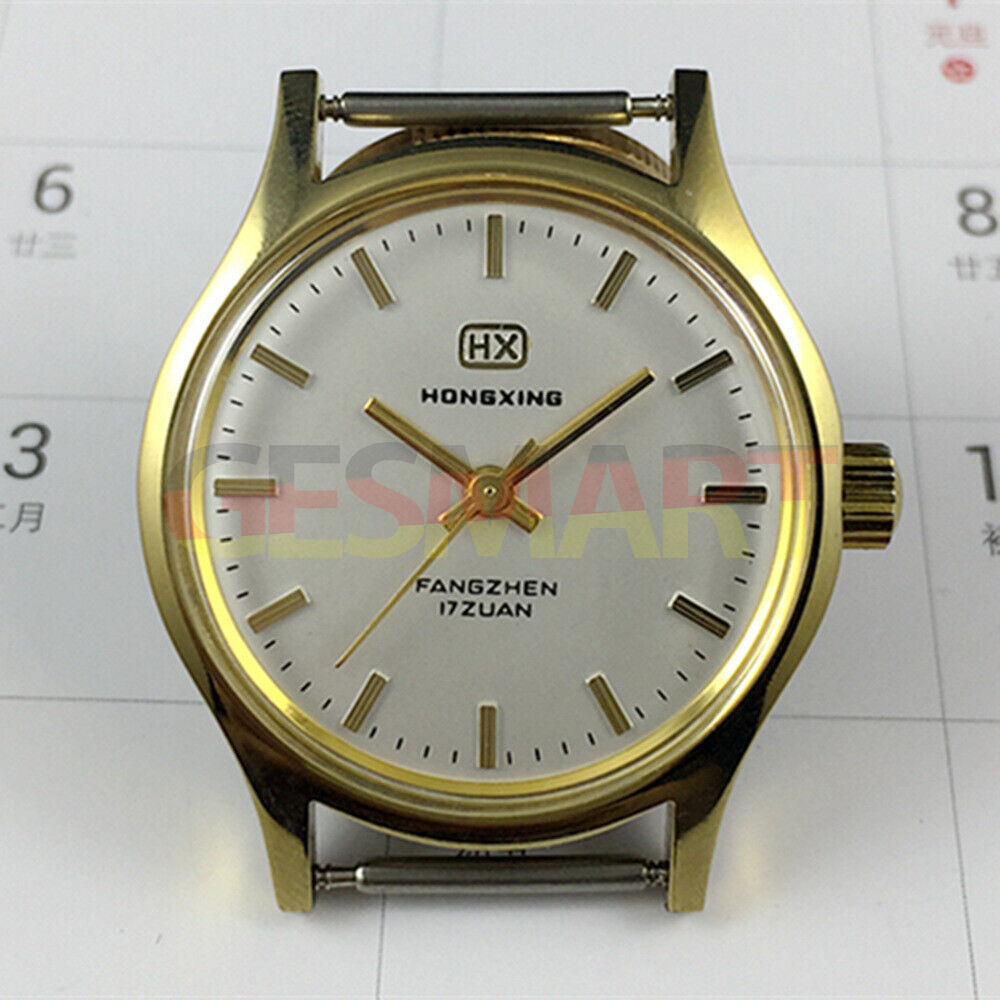 33mm manual watch with golden nails, silver dial, and round golden case for classic style.