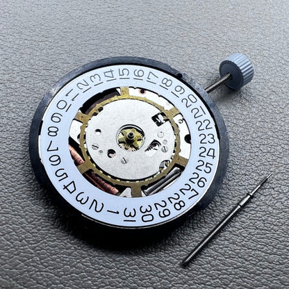Swiss Ronda 715 quartz watch movement with date display at 3 o'clock, precision timing for accessories.