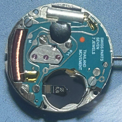 Swiss Made ETA956.114 quartz watch part with white dial and three hands for accurate time display.