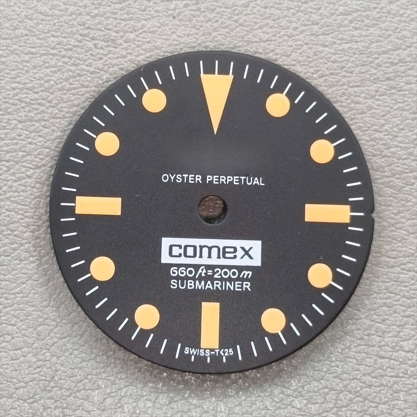 watch dial with R logo