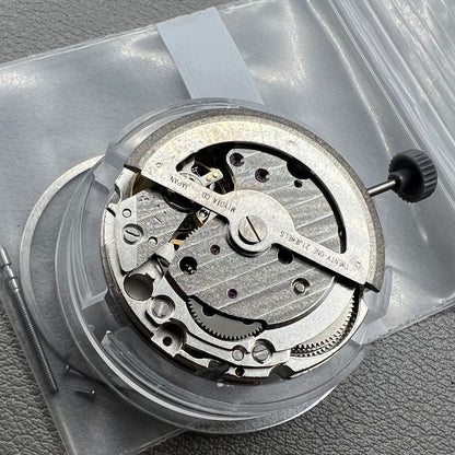 Japan Miyota 8218 automatic watch movement with date at 9 o'clock and two hands, precision timekeeping.