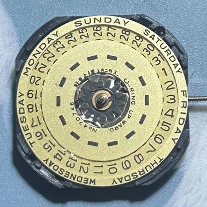 Japan Made YL44A quartz watch movement with 3 hands, double calendar, and golden disk for precise timekeeping.
