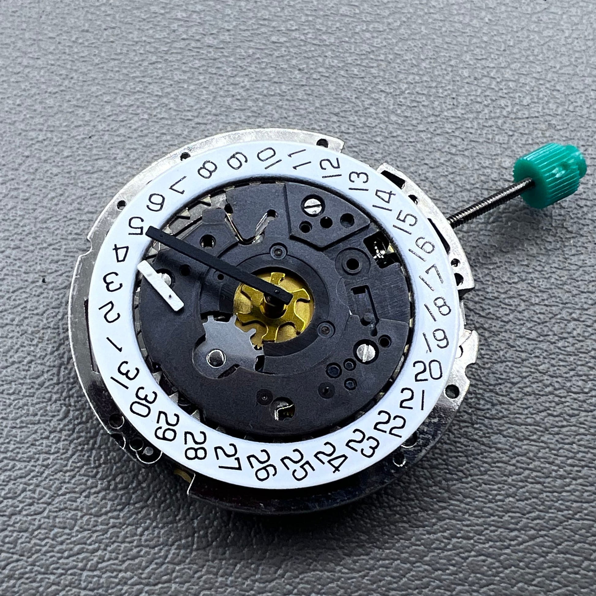 Swiss ISA 8172 silver plated quartz watch movement with stem, precise timekeeping for watch repair and assembly.