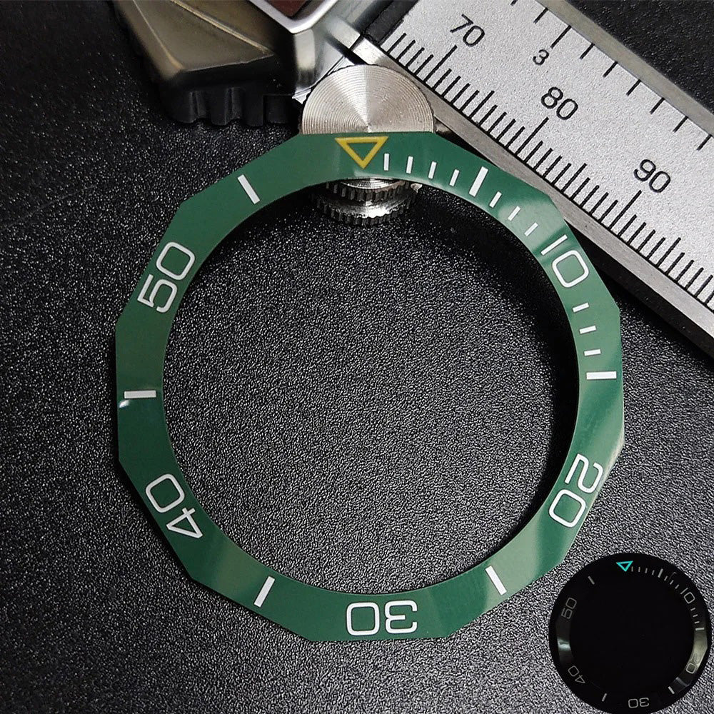 Sloping luminous ceramic bezel insert 42.3x33.3mm for automatic watch replacement, precise fit and durability.