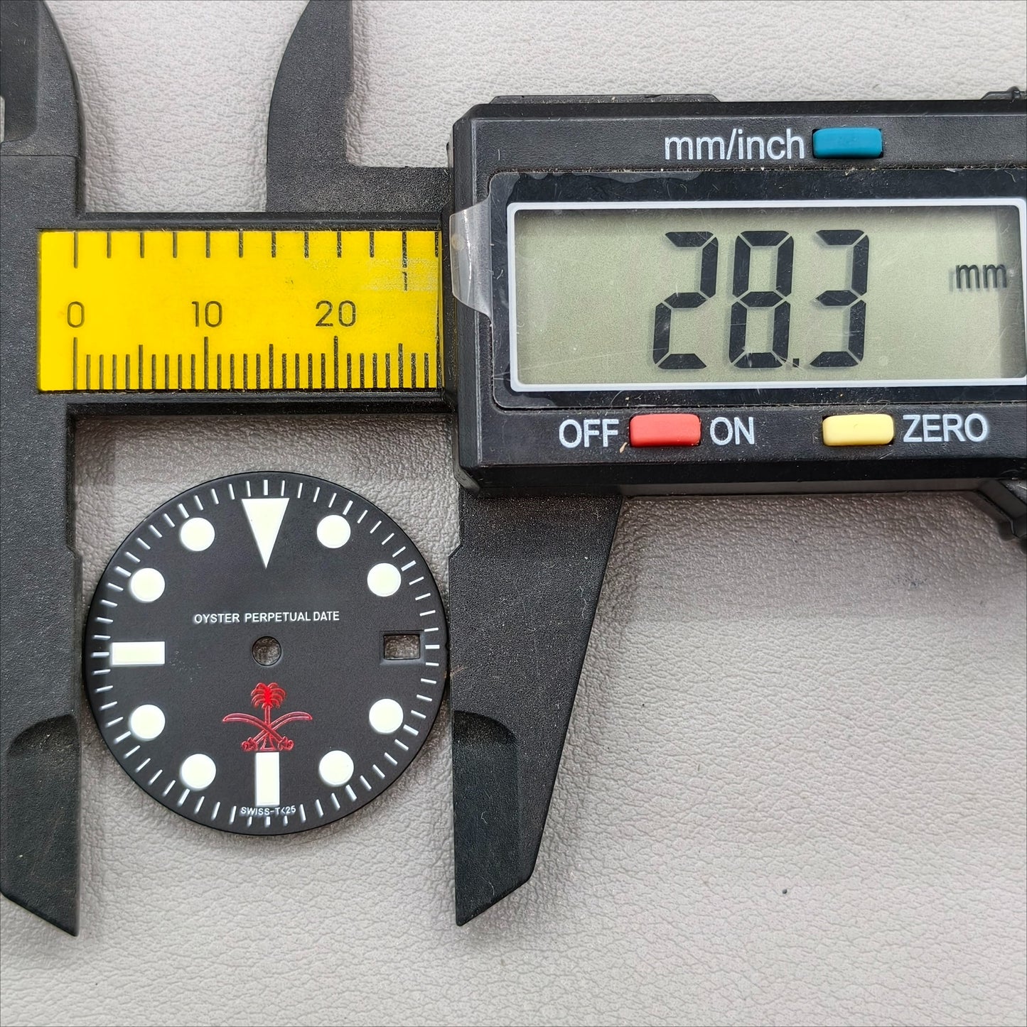 watch dial with R logo