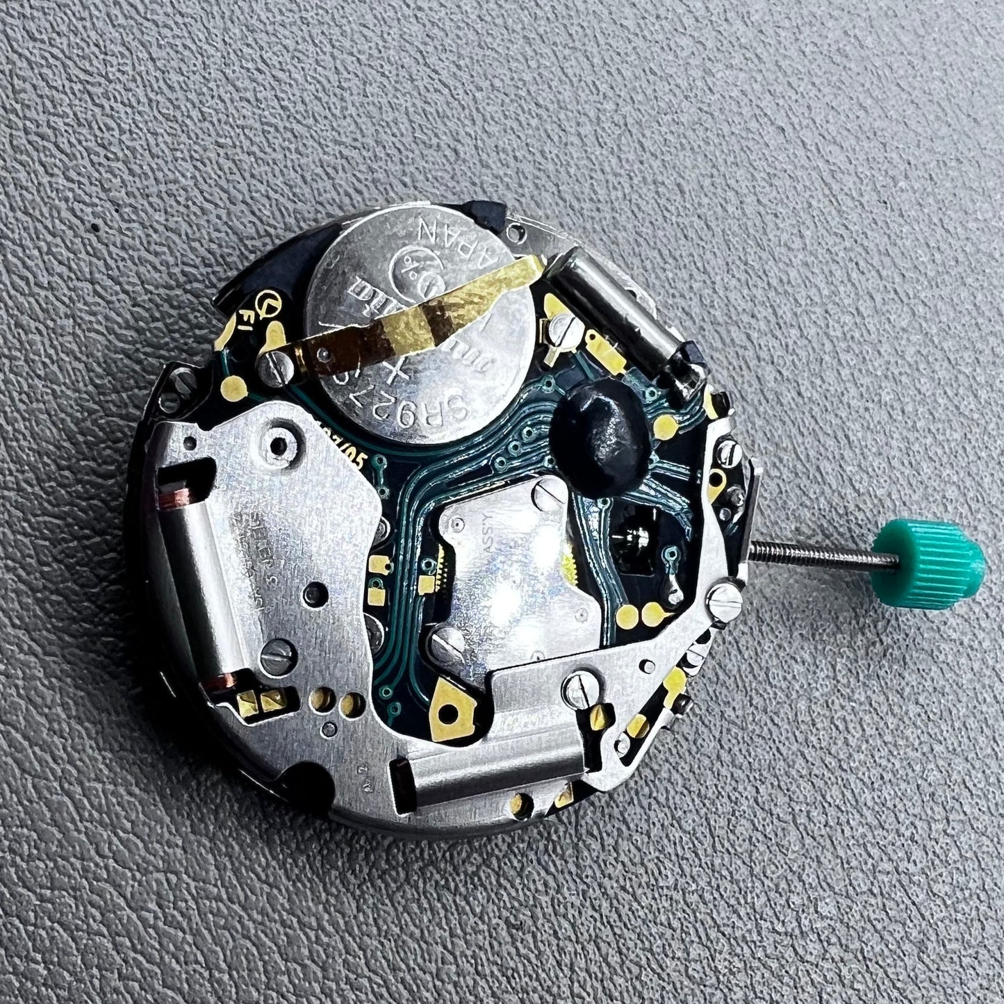 Swiss ISA 8172 silver plated quartz watch movement with stem, precise timekeeping for watch repair and assembly.
