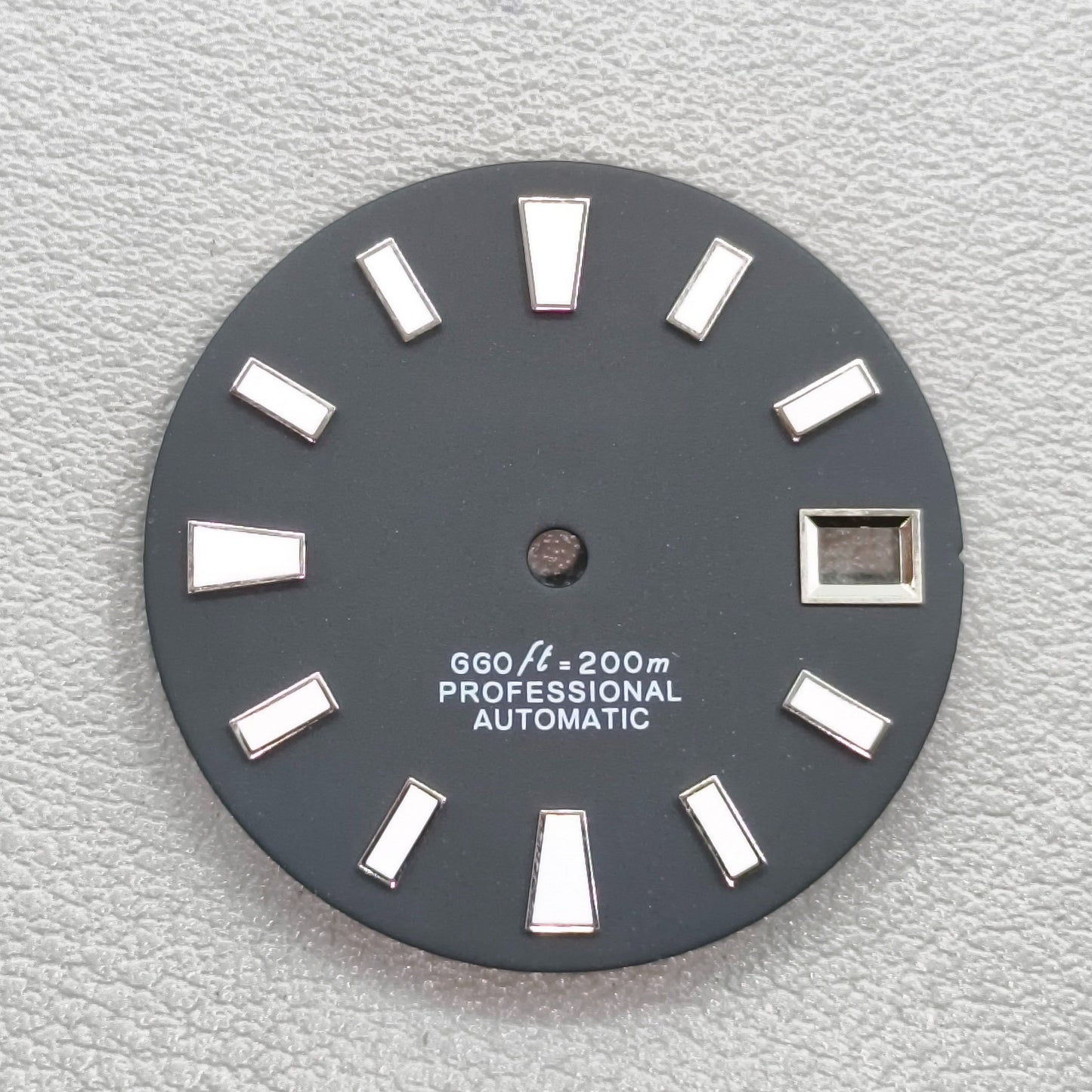 watch dial with S logo