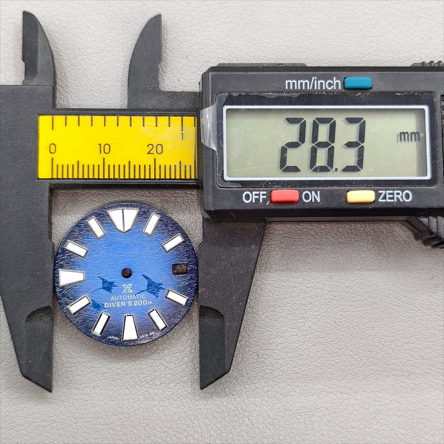 watch dial with S logo