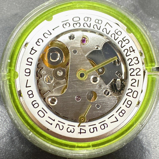 Close-up of China Made 2824 automatic mechanical watch movement with small second hand, precision timekeeping.