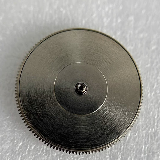 Complete barrel with mainspring for Glashutte100 watch movement, precision fit for smooth timekeeping.