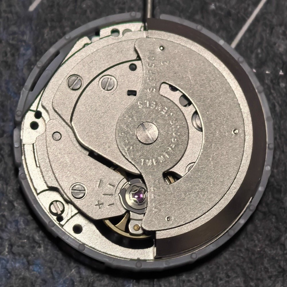 Japan Made YN77 mechanical watch movement, precise stock part for watch repairs and upgrades.