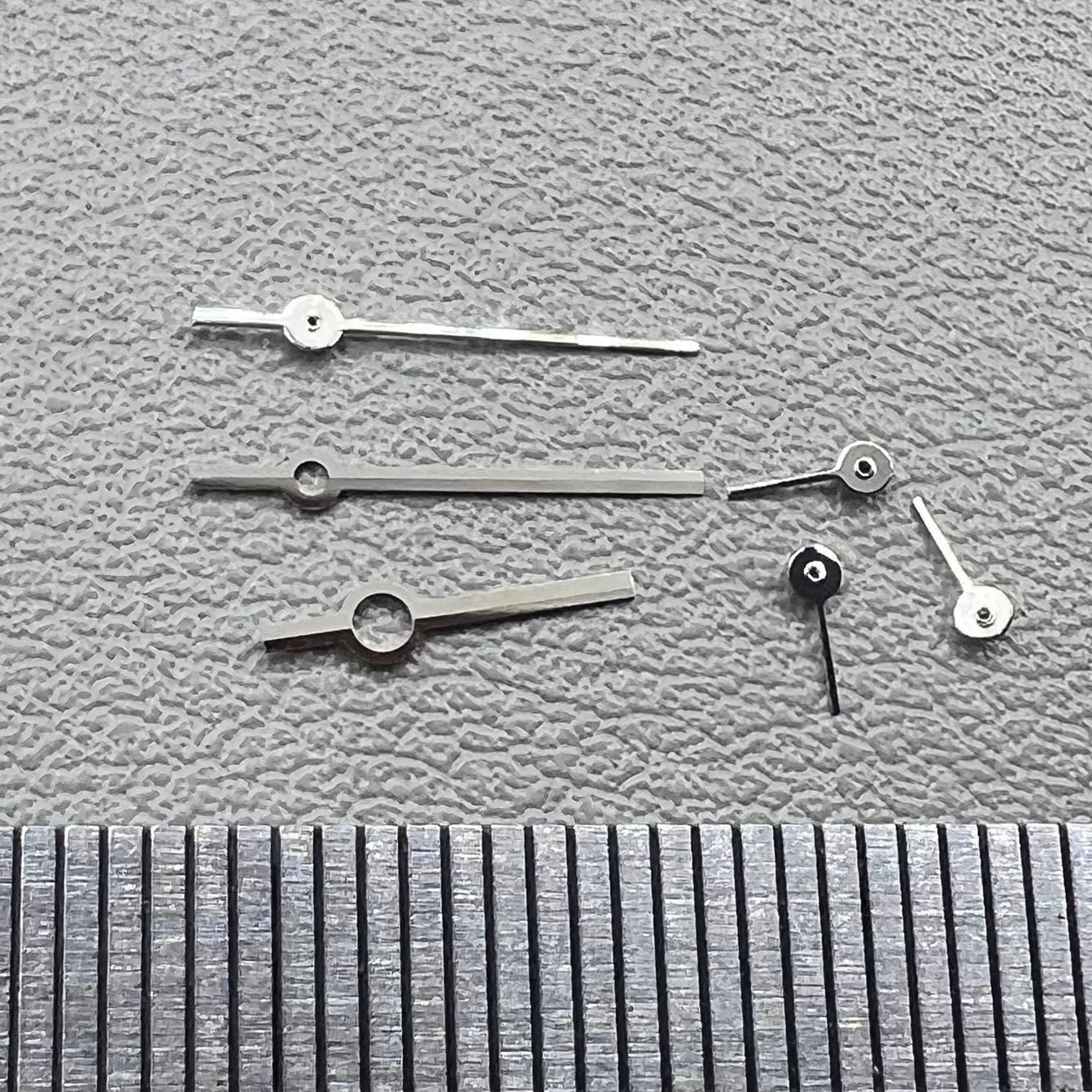 Silver watch hands set compatible with Ronda 5030.D quartz movement, precision timepiece parts.