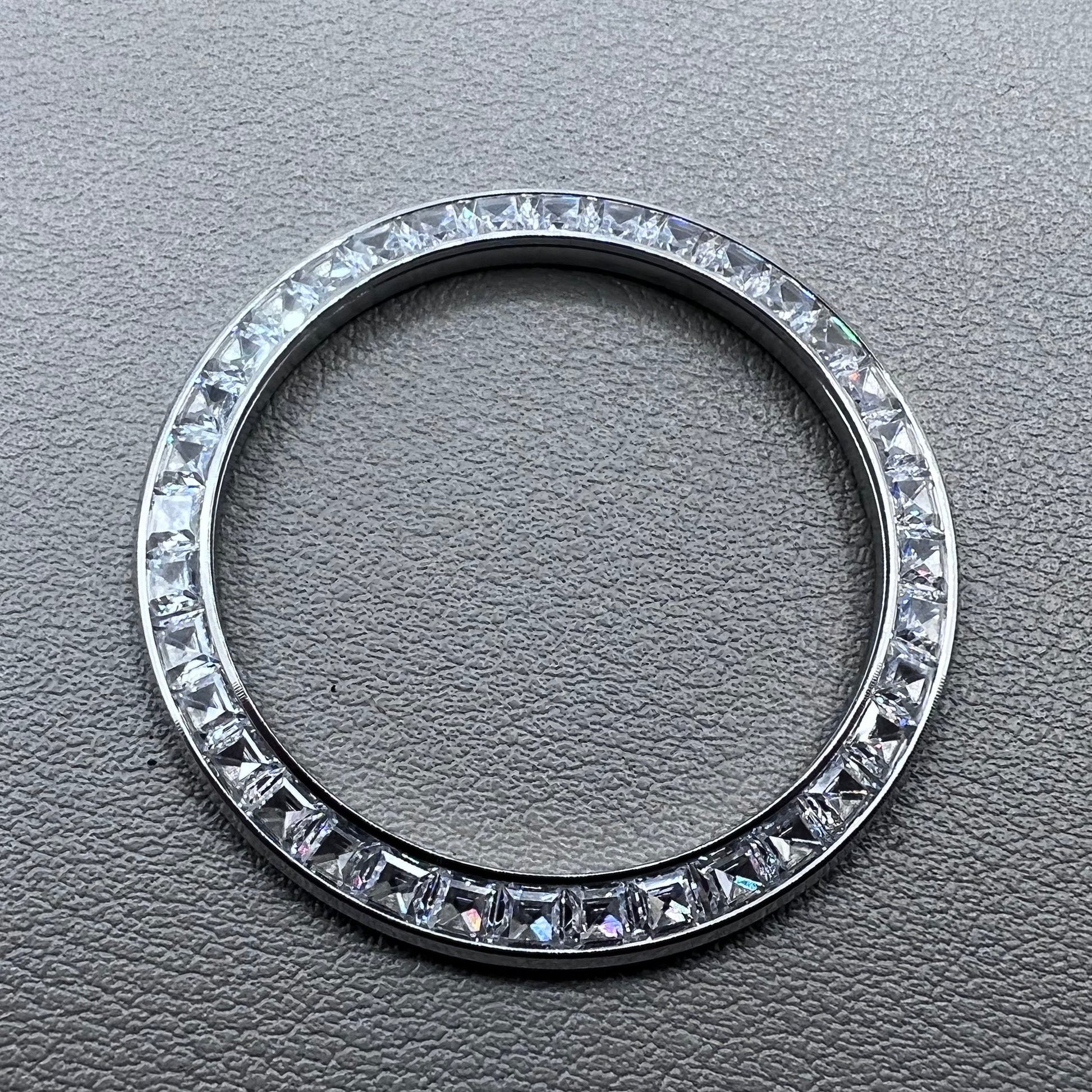 Silver 39.4mm Daytona watch bezel with T-shaped square diamond moissanite, flat bottom design.