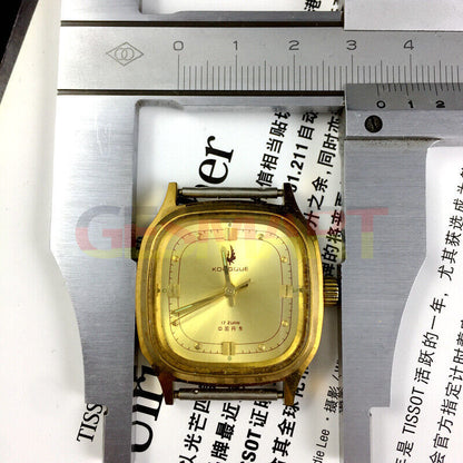 33mm Dandong manual watch with 17 jewels, golden dial, and square case for elegant style.