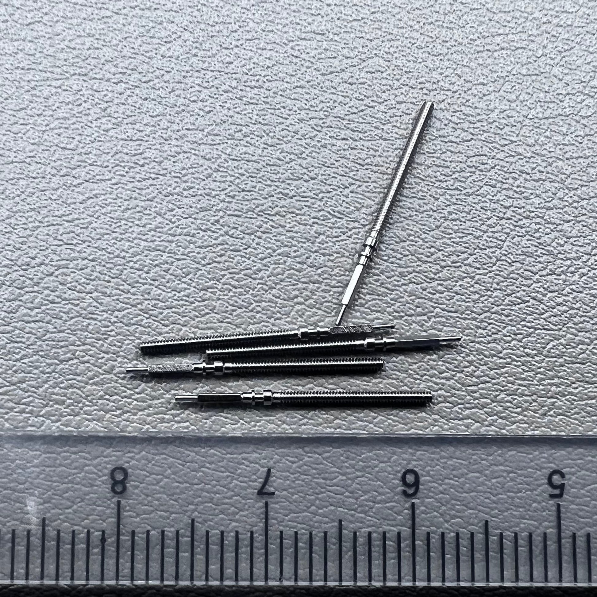Set of 5 Omega winding stems for watch repair, compatible with 560-565 movements, precision spare parts.