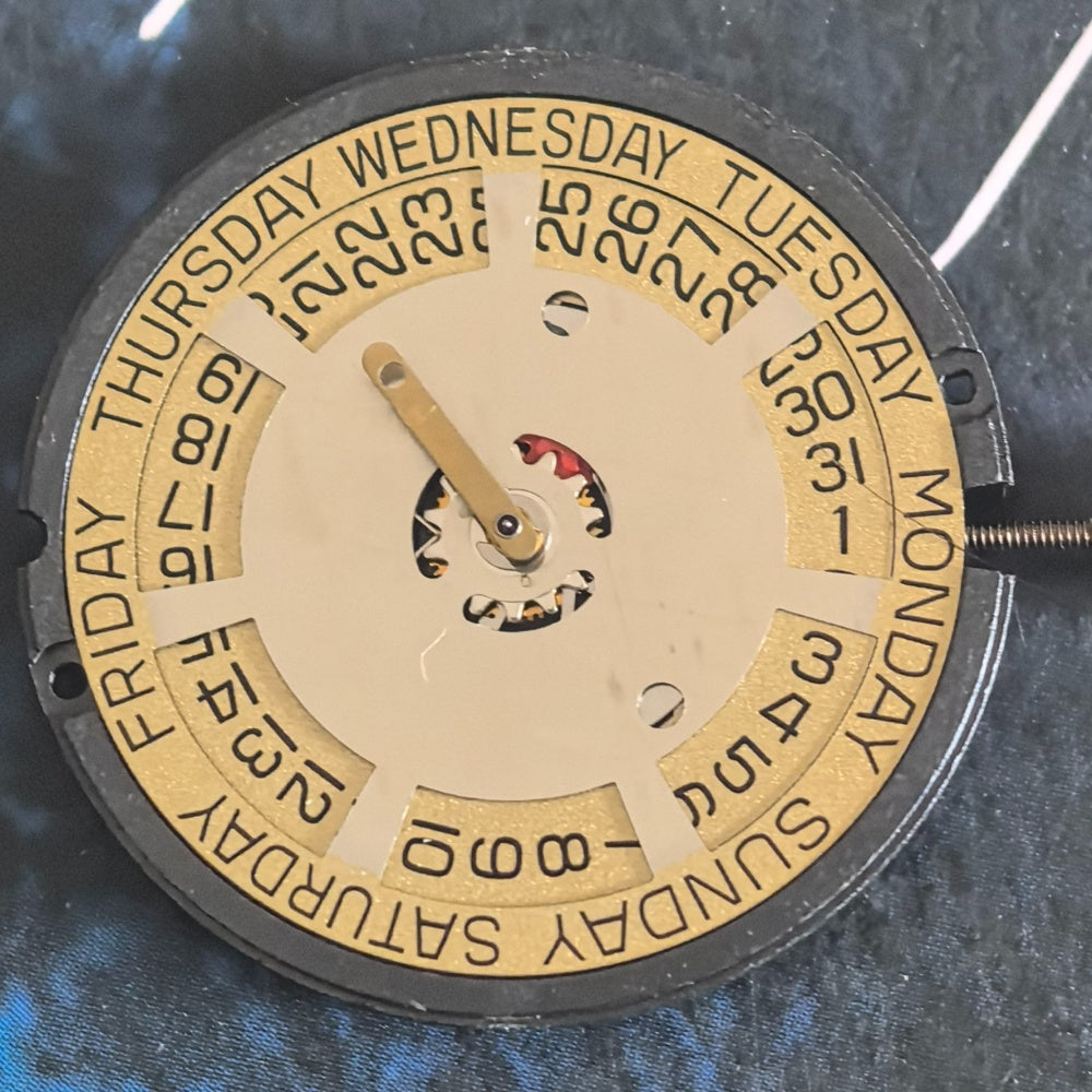 Swiss ETA805.144 quartz movement with golden disk, 3-hand watch part for precise timekeeping.