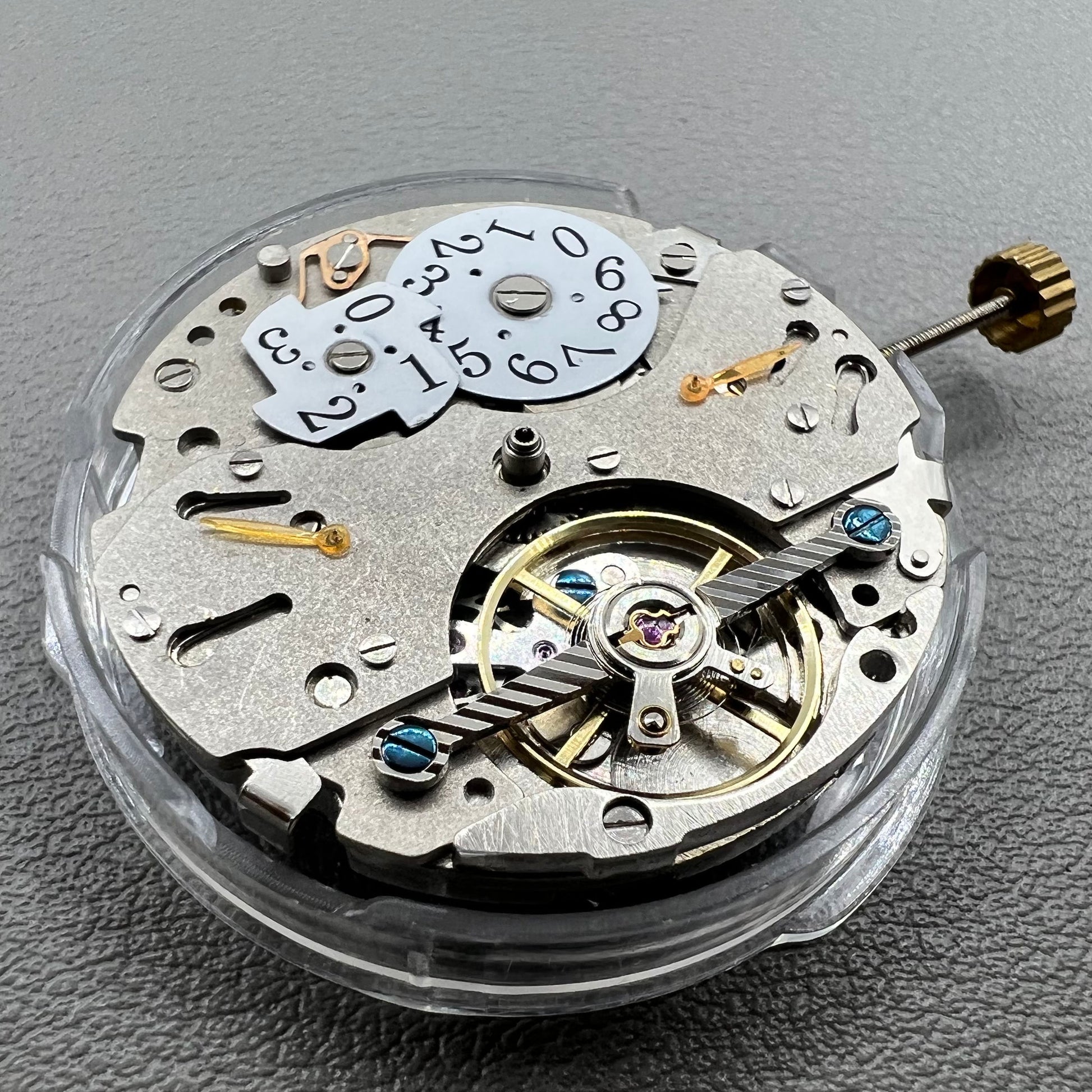 Wenzhou Mechanical watch movement with bare balance wheel and big date display at 12 o'clock.