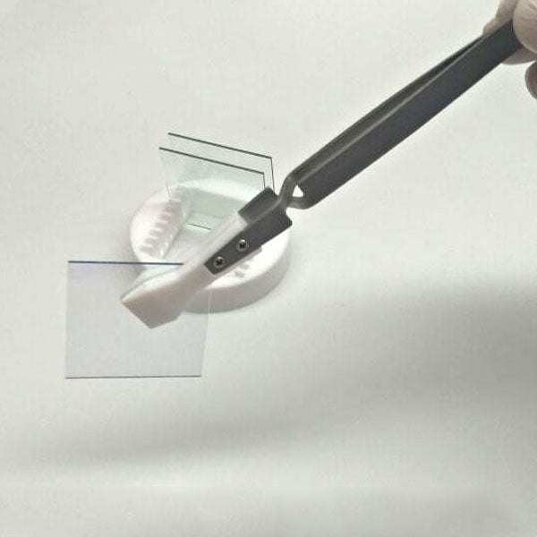 Wide headed PTFE tweezers, acid and alkali resistant, reverse self-locking for secure handling.