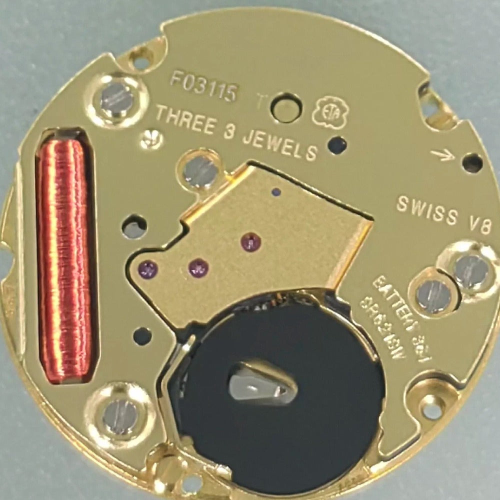 Swiss Made ETA F03.115 quartz watch movement with three hands and date at 6, precision timekeeping component.