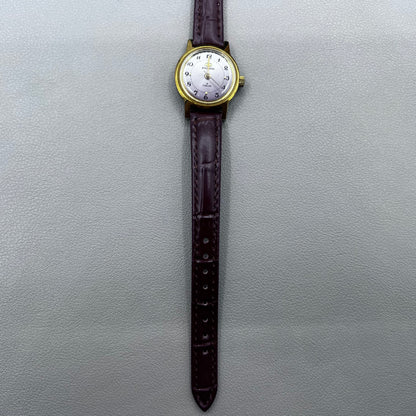 Dark Brown Strap Round Case 3 Hands Purple Background Manual Mechanical Watch
