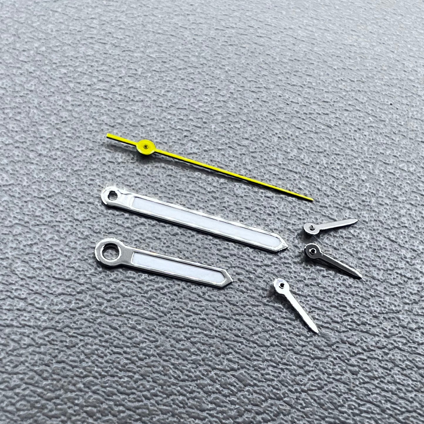 Silver-trimmed yellow lume watch hands with second hand for VD53, VD54, and VD57 movements.