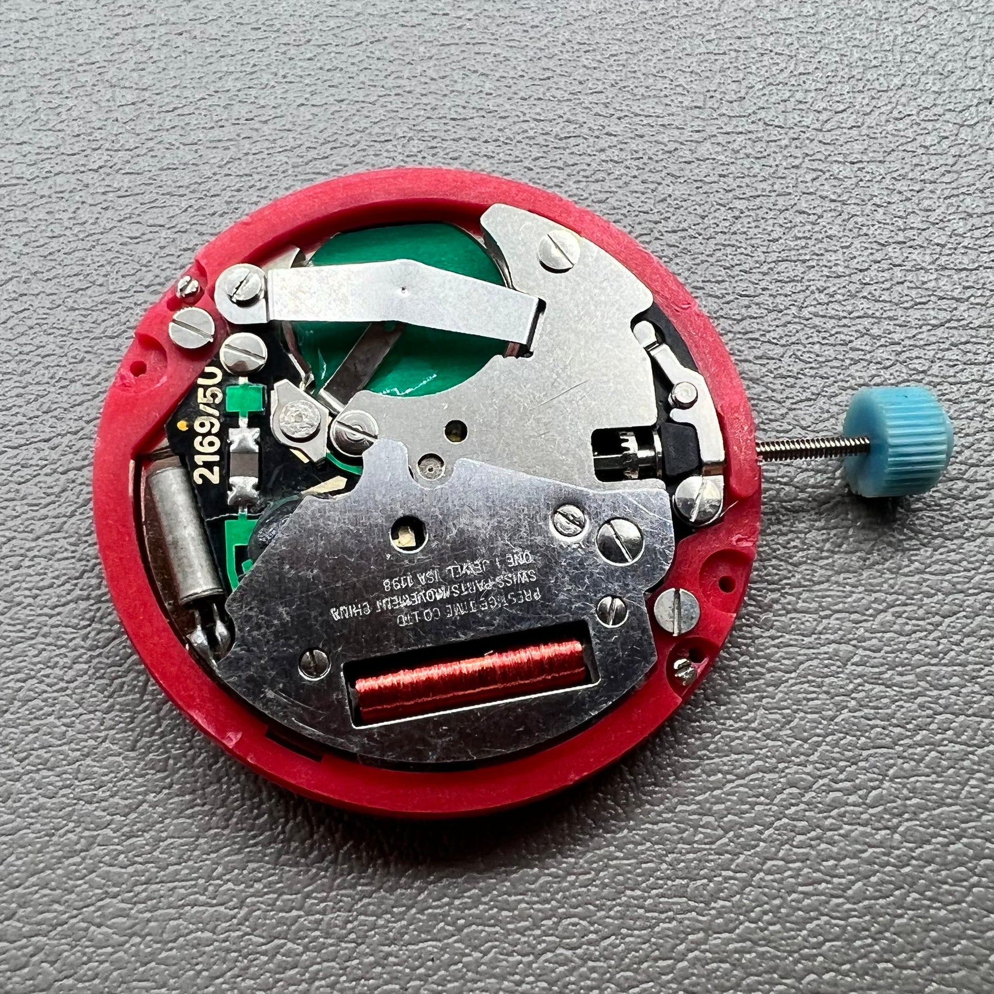Swiss ISA 1198 watch movement with golden dial, date at 3 o'clock, weekday display, premium watch accessory.