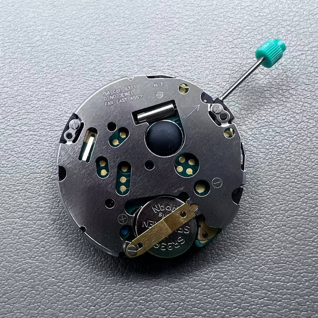 Swiss ISA 8371B quartz watch movement with date at 3 o'clock, white disk, silver-plated finish, precision timekeeping.