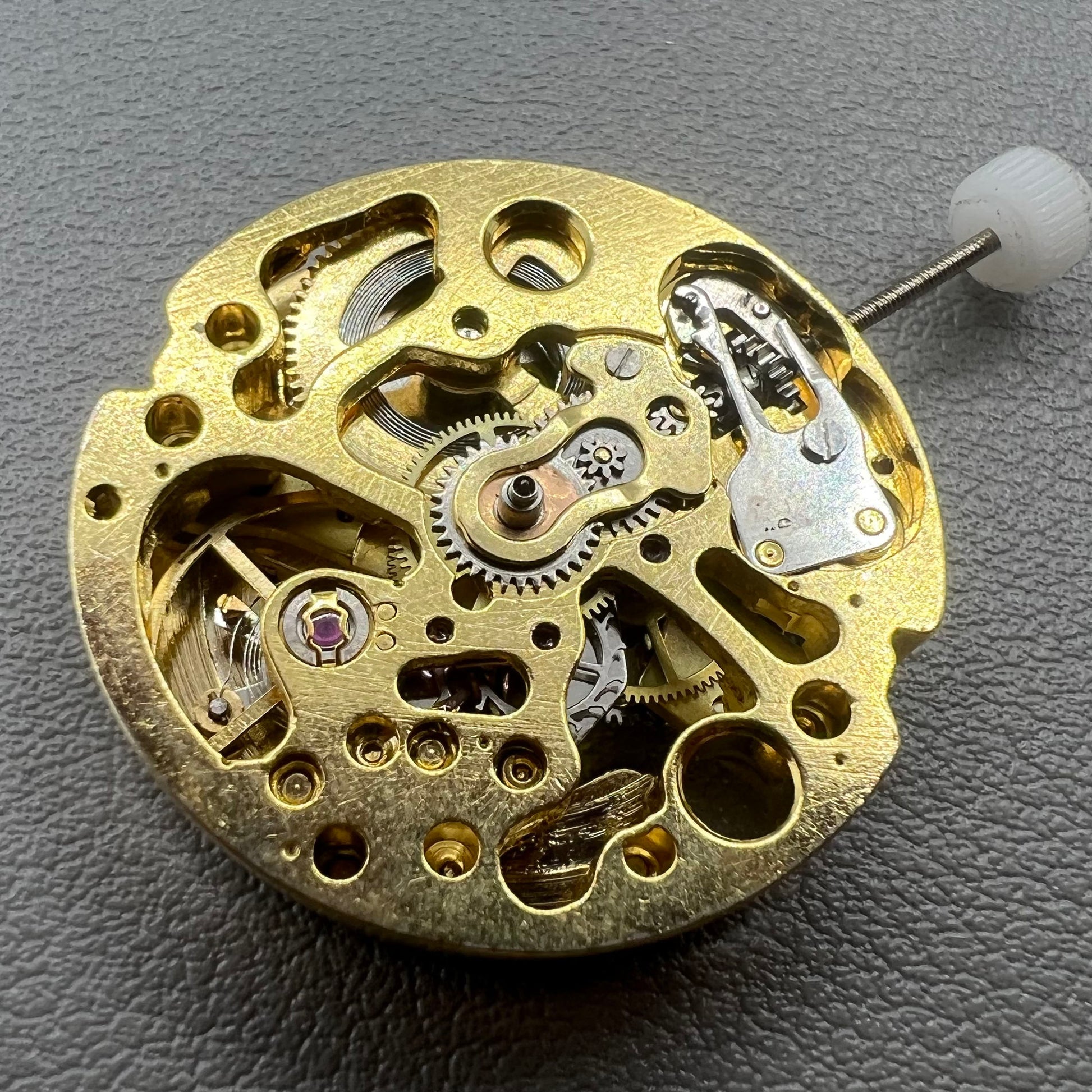 Golden 26.5mm hollow carved watch accessory with automatic 7120 mechanical movement, precision-engineered.
