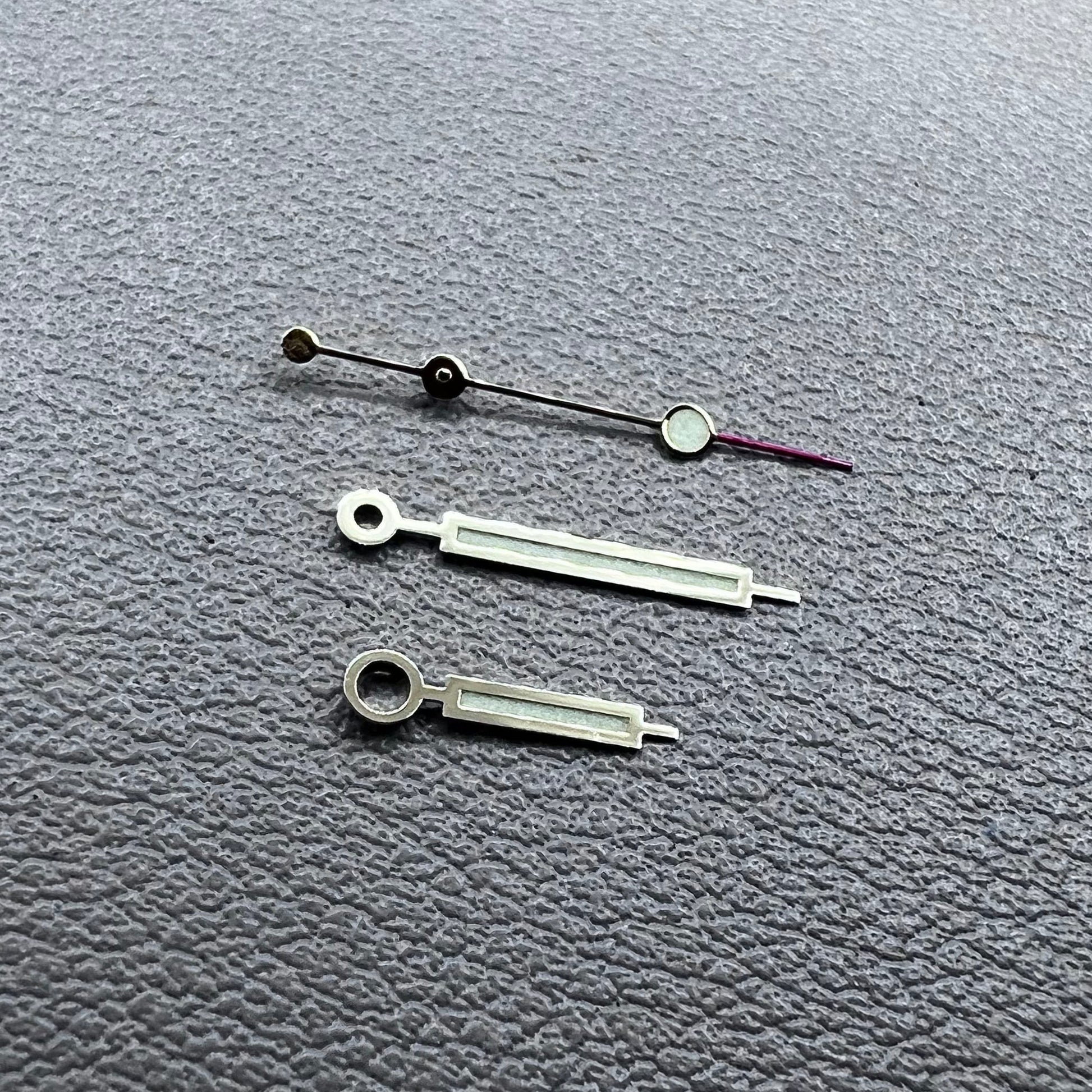 Green luminous watch hands with golden trim for NH35 NH36 movements, enhancing visibility and style.