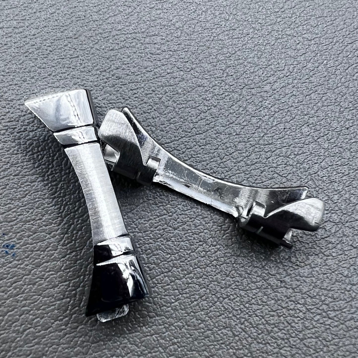 Polished curved end links spring bars set by for watch band strap replacement.