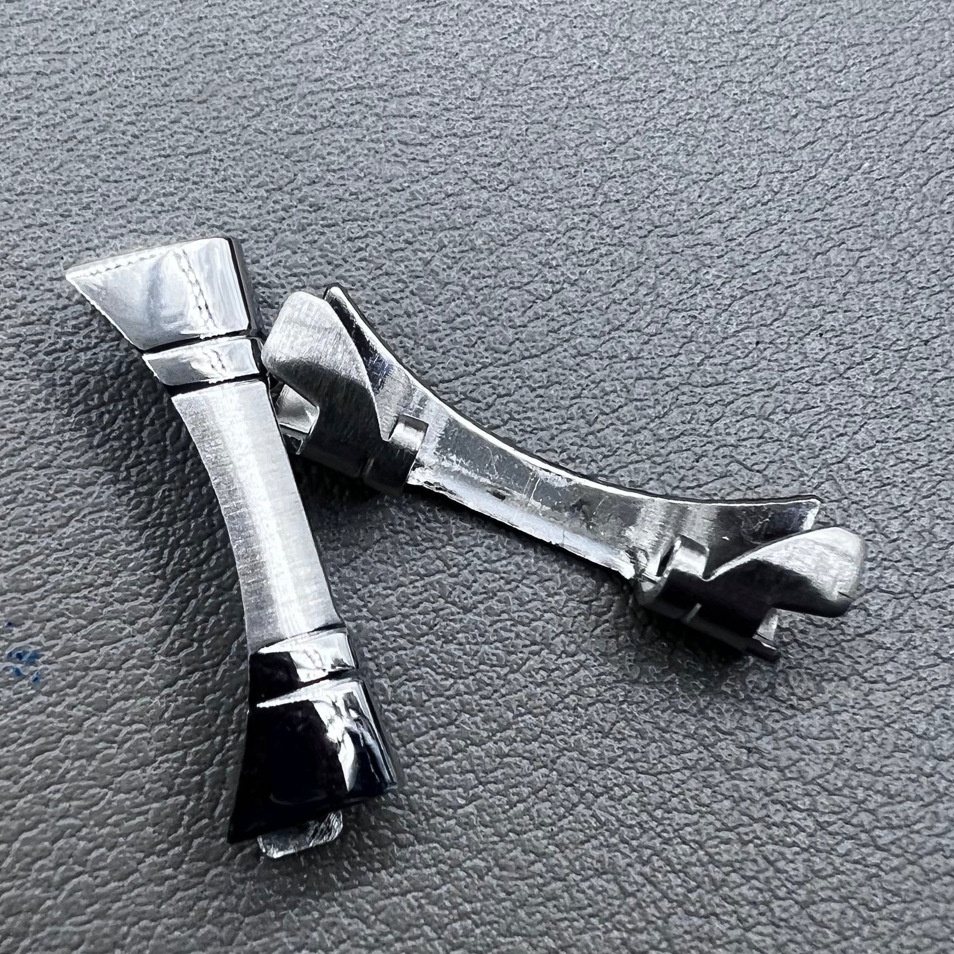 Polished curved end links spring bars set by for watch band strap replacement.