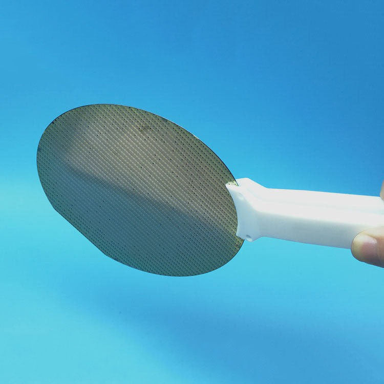 Wide-headed PTFE tweezer with acid and alkali resistance, ideal for handling silicon wafers.