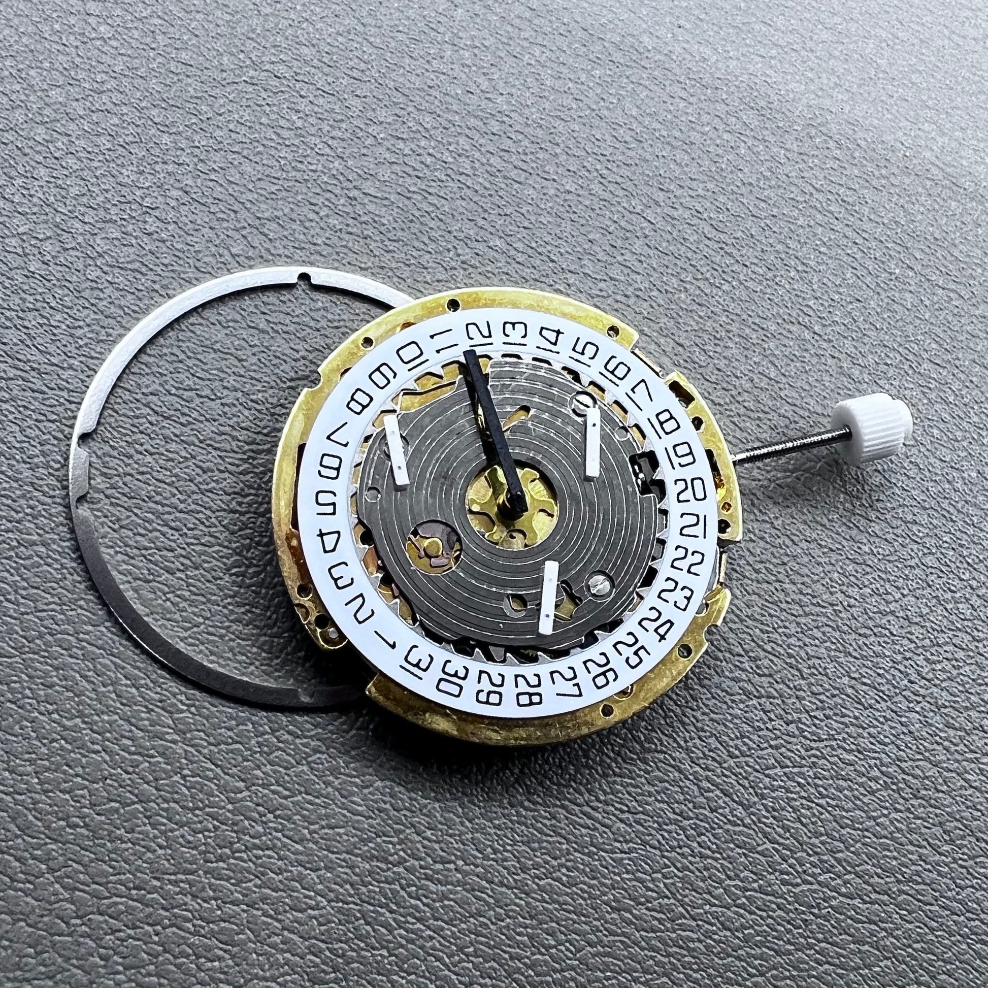Swiss ISA 8171 golden quartz watch movement with date at 4 o'clock, multi-function design by Swiss ISA.