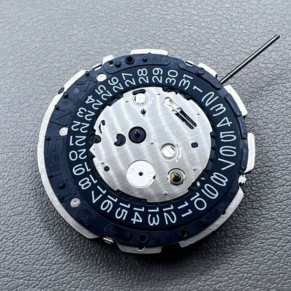 Original Japan Seiko 7L22A Quartz watch movement with black disk for precise timekeeping.