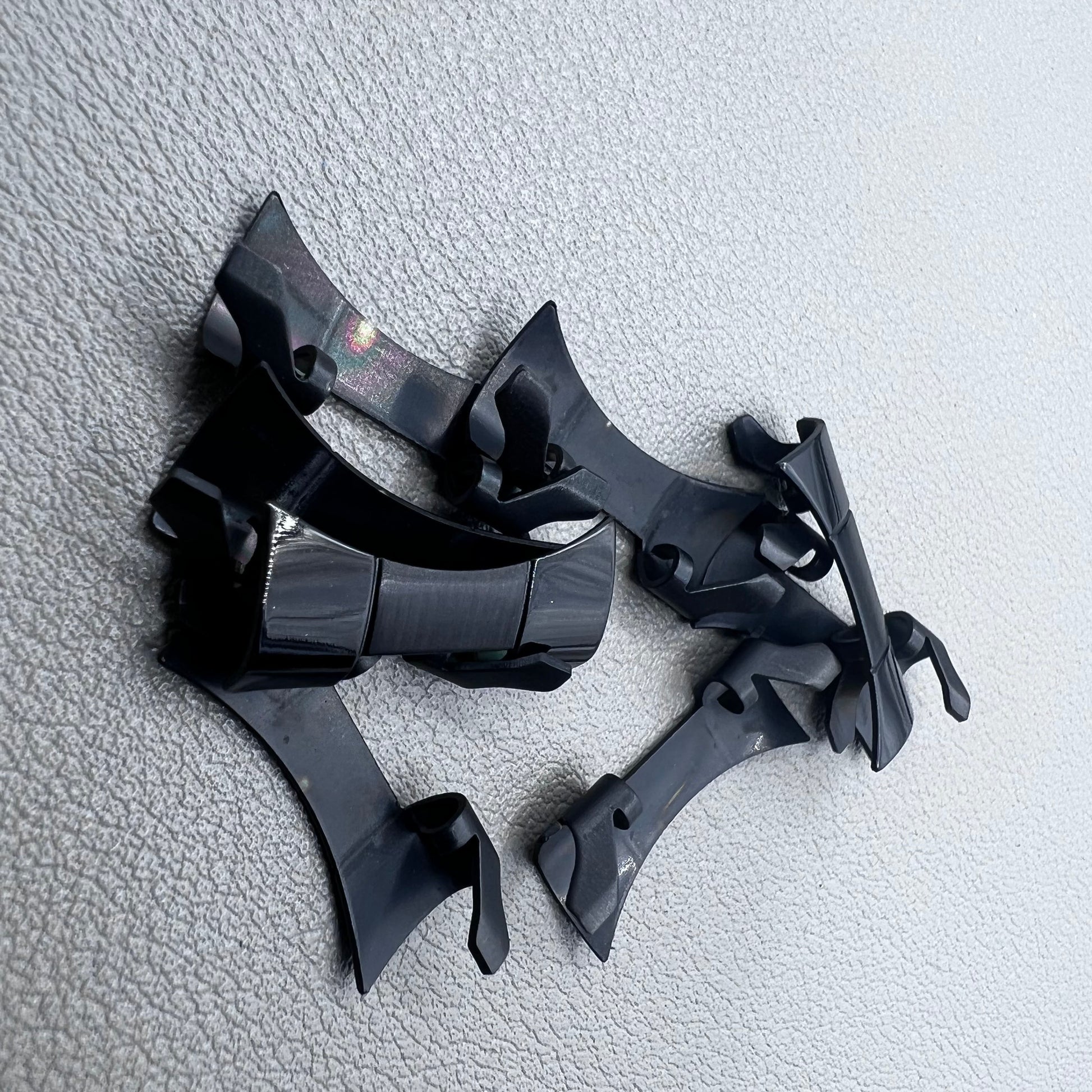 1. Six steel black matte curved end links with spring bars for durable watch band straps.  