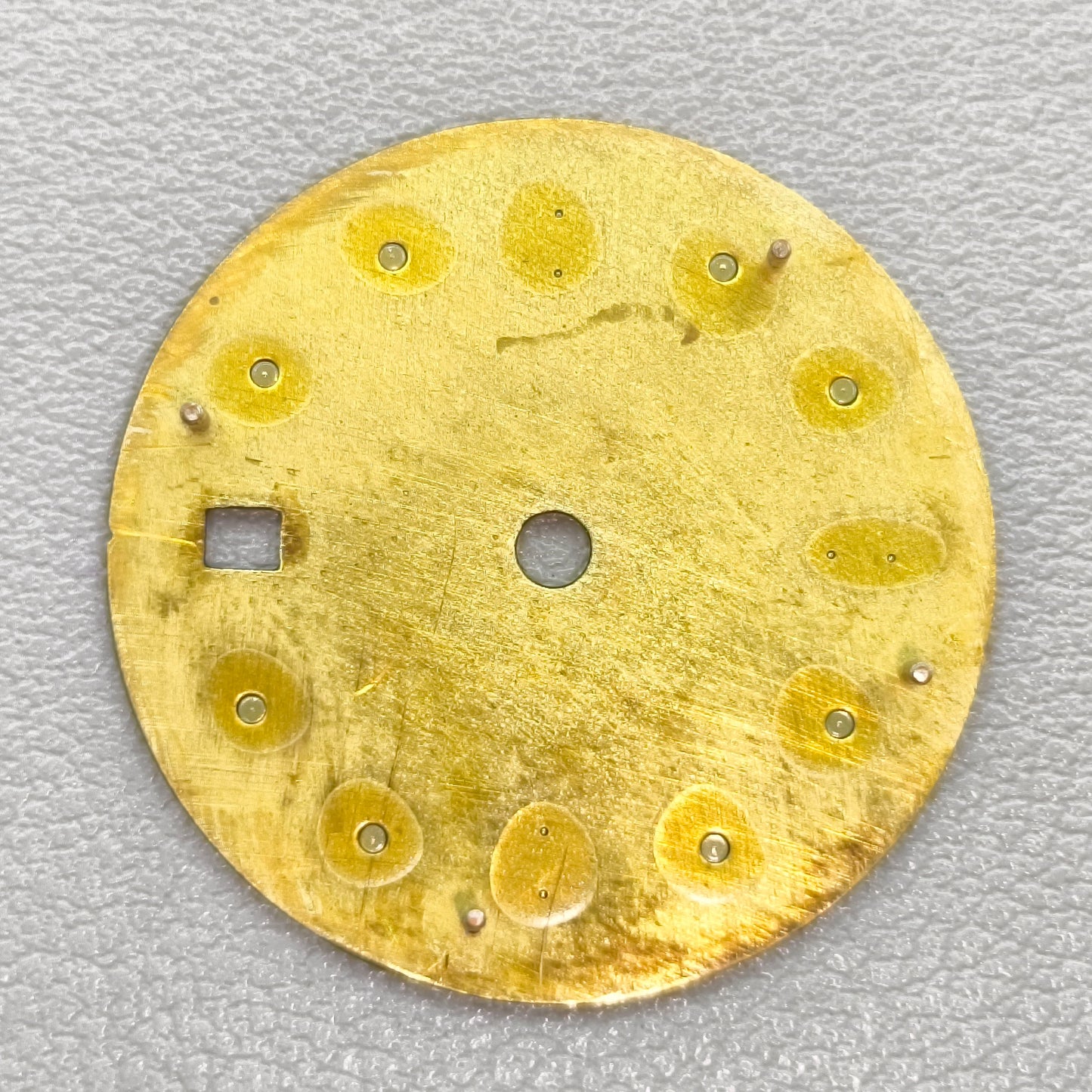 watch dial with R logo