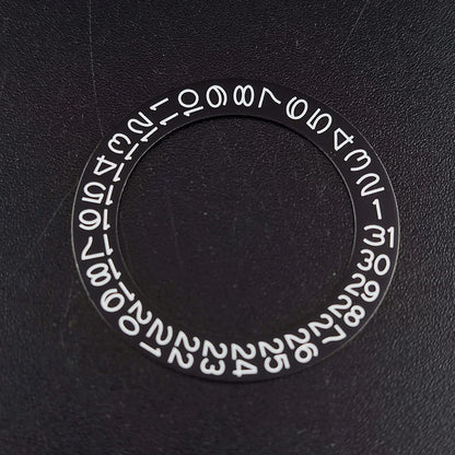 NH 35 watch calendar movement replacement parts with date and day wheel discs.