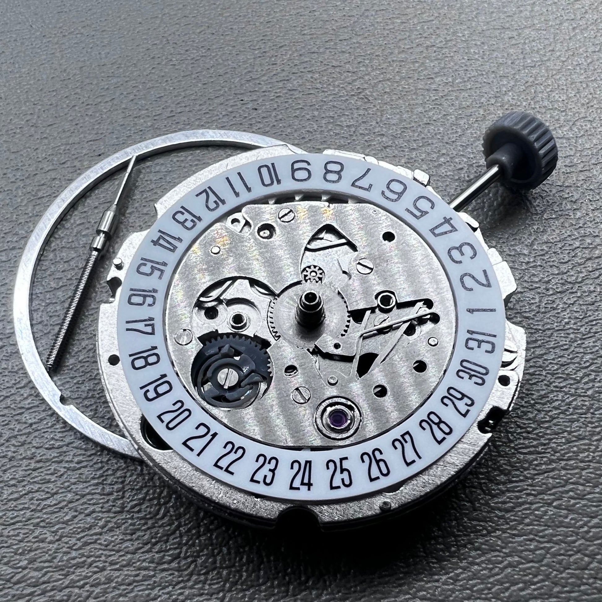 Miyota 8200 watch movement with single calendar date at 6 o'clock, precise Japanese mechanism.